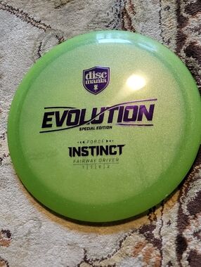 Discmania Evolution Instinct ForgeFairway Green Metal Flake W/ Purple Stamp 172G